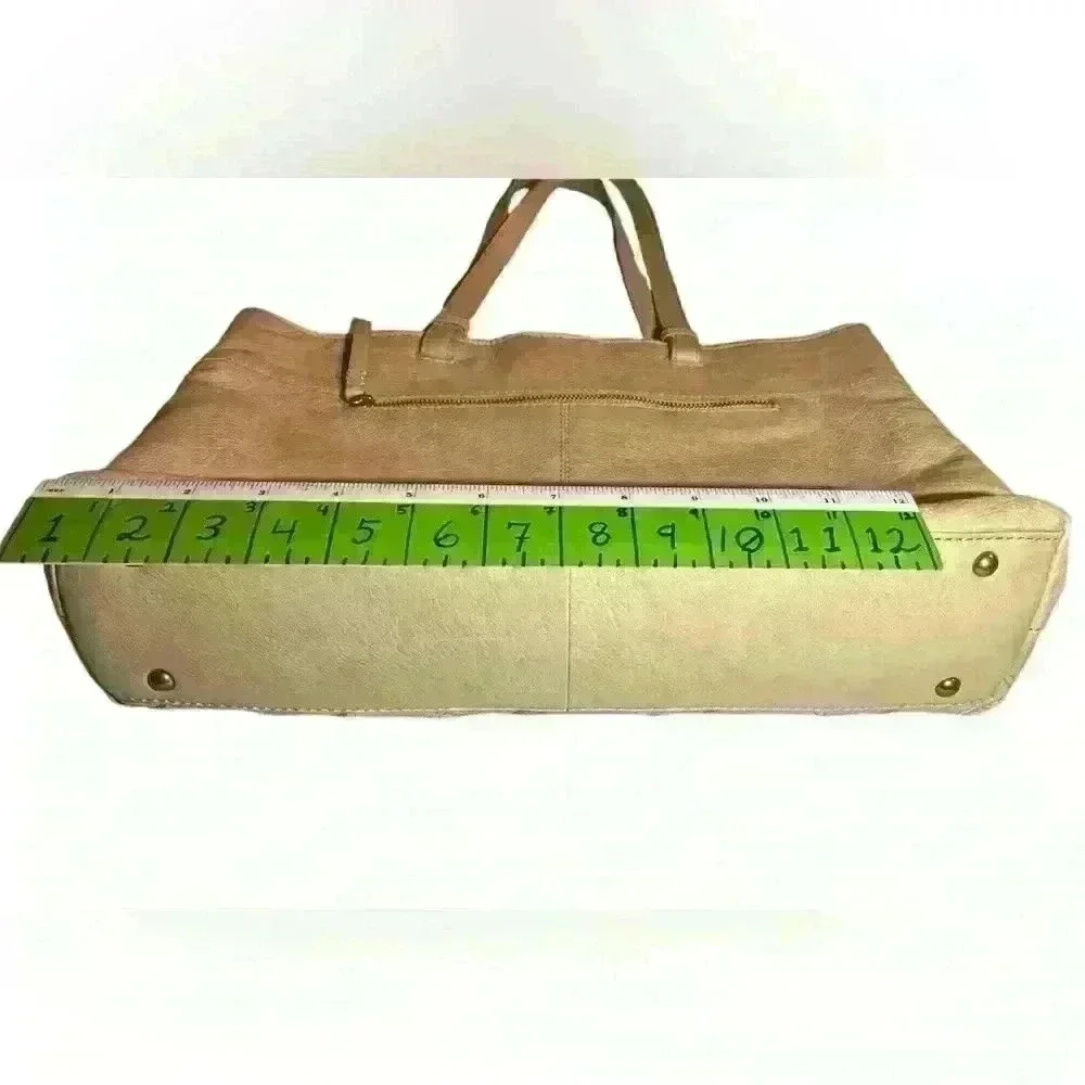 An American Leather Co. nude/cream colored leather woven tote bag.